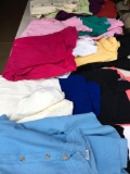 18 pieces. Aries and Taurus Assorted colors short sleeve woman's XXL and one size fits all blouses