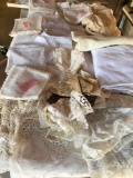 Large lot of table dressings, some pillow cases. Assorted napkins, table cloths, etc