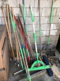 Assorted brooms, dust pans, handles, etc  qty 16 pieces