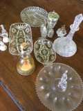 12 pieces. Crystal, glass, plastic pieces. Serving dishes, carafe, condiment caddy, etc