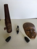 Assorted decorative items. Mask made in Mexico wood with metal figurine, wood hand carved bottle