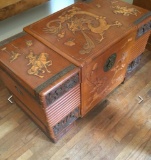 Hand carved, vintage Oriental chest with metal accents & (3) blankets/quilts