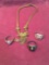 4 pieces. Costume jewelry. Necklace & 3 rings. Size woman?s 8,'2) men's 10