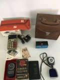 Camera Equip. Vintage bag, slide rule, pocket slater, GE exposure meter, pilot meter.