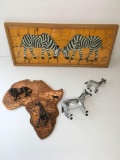 Commemorative Items bought on a trip to Kenya. Assorted wall decoration and figurines