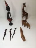 African Art (4) Hand carved wood figurines & (3) plastic stirs. Giraffe has stickers 