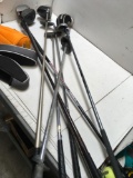 8 pieces. Assorted golf clubs and socks