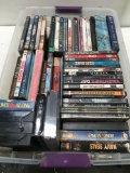 54 pieces. VHS, Books, games, majority are DVDs