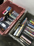 Over 50 DVDs/ VHS. Plastic tubs not included