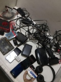 Lot Assorted items. Cell phones, Garmins, cords, speaker cable, etc