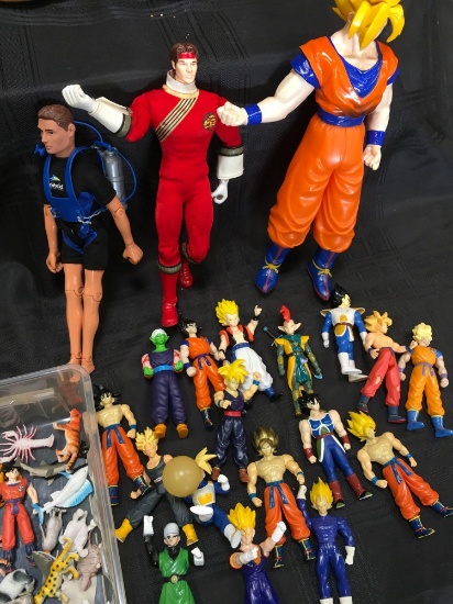 Lot. Assorted children's toys/figurines. 45 pieces & plastic storage box