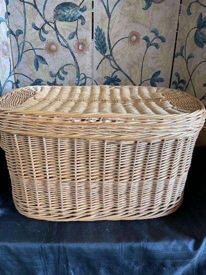 Large wicker basket with lid and handles. 15" T x 29" W x 17" D
