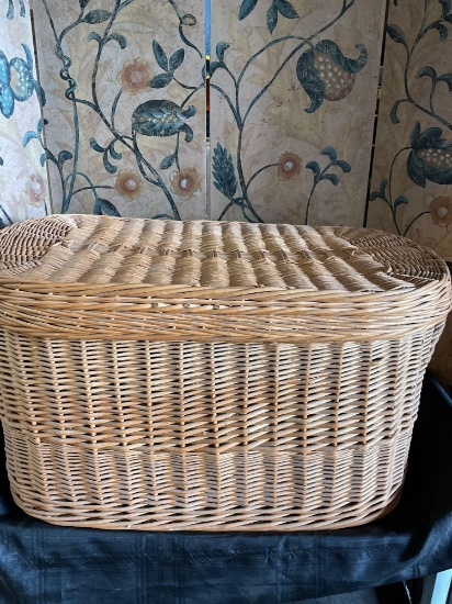 Large wicker basket with lid and handles. 18" T x 36" W x 20" D