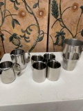 Assorted stainless steel items. 4) cups 2) Inox GG creamers Amco & Ecco measuring cups