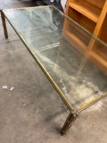 Vintage rustic, coffee table. Glass top, metal frame. 16