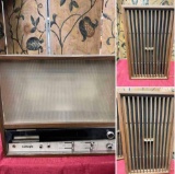 Vintage Carnegie Stereo, turned on, with 2 Panasonic speakers.