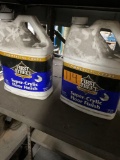 Commercial Grade First Street Super acrylic Floor finish. 2 bottles one is open and some liquid has
