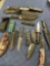 Assorted knives, foldable knives , sheaths, ammo box. 14 pieces