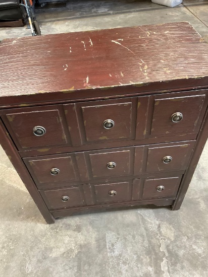 Three drawer wood dresser with metal accents. 32" x 27" x 14"