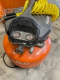 Ridgid 6 gal, 150 PSI , portable, electric air compressor. Turned on