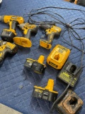 Assorted Dewalt tools, chargers, charger stations. 9 pieces