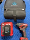 Skil drill, charger station, battery ( turned on) & Nissan case