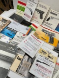 Assorted gun and scope manuals. 26 pieces