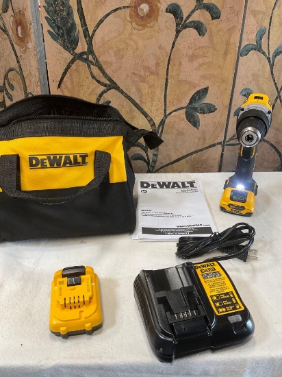 Dewalt bag, DCD706 drill driver, charger station and two batteries. Turned on WORKS