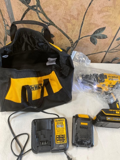 Dewalt bag, DCD777 cordless drill driver with two batteries and charger station. Turned on WORKS