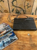 Philips DVD player with remote & 6 DVDs with remote. Turned on