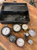 Tool box and assorted pressure gauges. 5 pieces