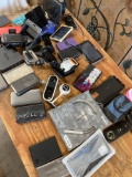 Assorted portable chargers, solar panels, GPS units, cases, etc. 34 pieces