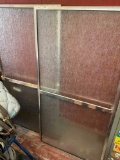 Rain glass, aluminum frame, shower doors with handles. Each measures 56