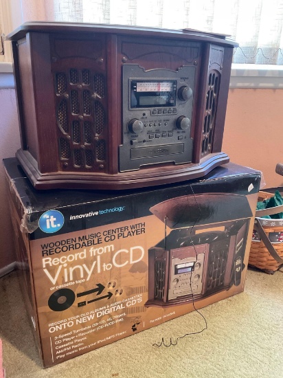 IT wooden music center with recordable CD player. Turned on see pic