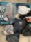 American Tourister luggage and assorted woman's clothing, majority seem to be xs, s