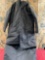 Black, insolated , hoodie, pockets coat that converts into sleeping bag. Seems to be a L/ XL