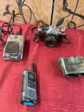 Assorted items. Canon camera, Robins pedal, Motorola walkie talkie, Tasco binoculars