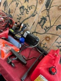 Automotive assorted items. Jumper cables, gasoline cans, tire inflators, funnel, etc