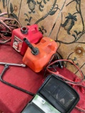 Assorted items. Wrenches, jumper cables m booklet, gasoline containers. 7 pieces