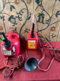 Assorted items. Gasoline containers, funnel, jumper cables. 5 pieces
