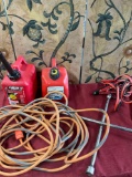 Gasoline cans, electrical cord, star wrench, jumper cable. 5 pieces
