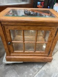Wood/glass cabinet. Mirrored back, one glass shelve. 26