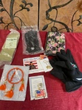 New. Gloves, bag, key chains. 8 pieces
