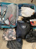 American Tourister luggage and assorted woman's clothing, majority seem to be xs, s