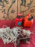 1 gallon gasoline container, Hydraulic jack, rope, tie