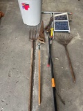Rubbermaid trash can, solar panel, polls, gardening tools