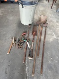 Rubbermaid trash with lid, gardening tools. hammers
