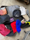 Chaps rolling luggage and assorted hats, clothes