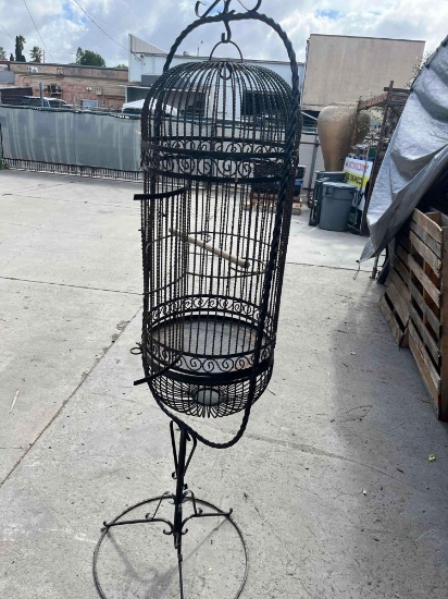 Large metal bird cage with stand. 76" x 22"