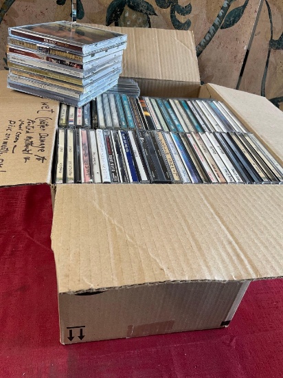 Assorted CDs. These CDs have water damage! Over 150 pieces